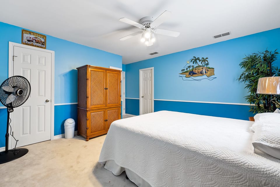 Relax in this bright guest room after a fun day on the island.
