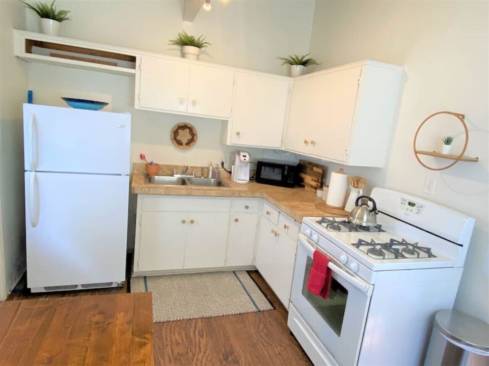 Bright, clean kitchen with all cookware, coffee, and amenities!