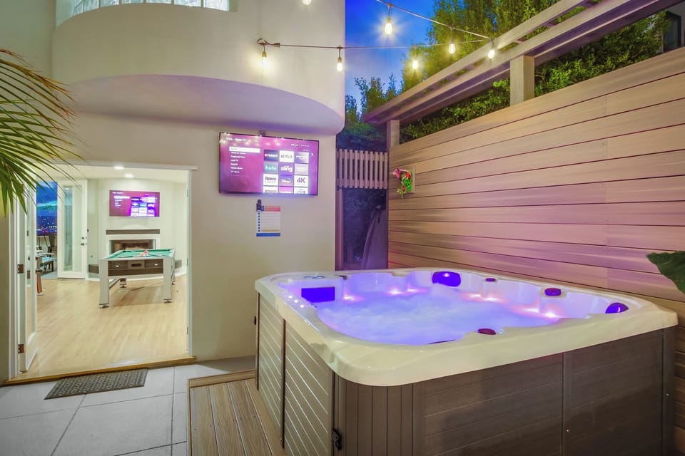 Soak in the private hot tub while enjoying music or TV—your own outdoor relaxation zone.