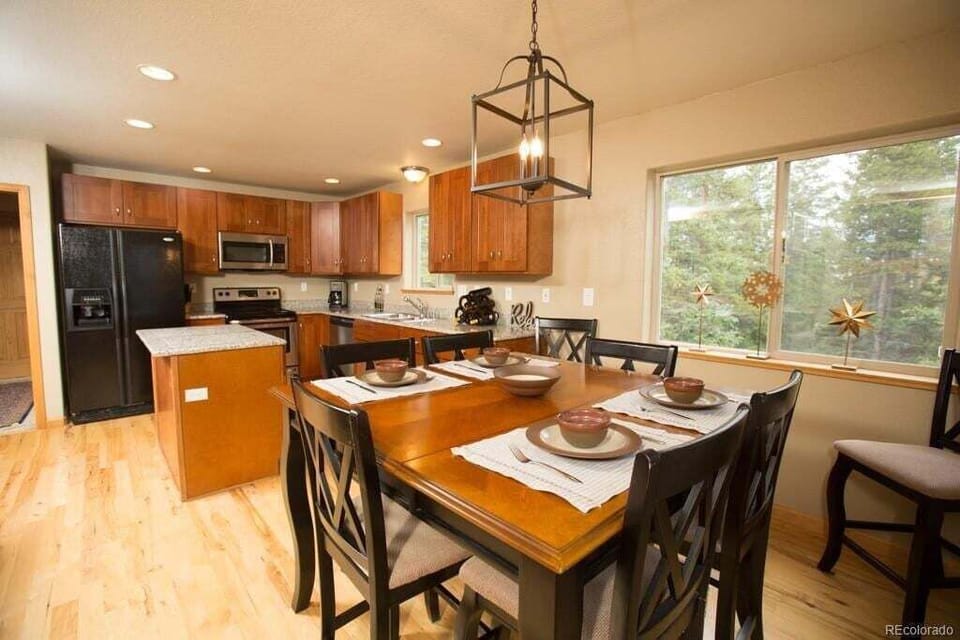 The dining room and kitchen are all part of the main great room open layout
