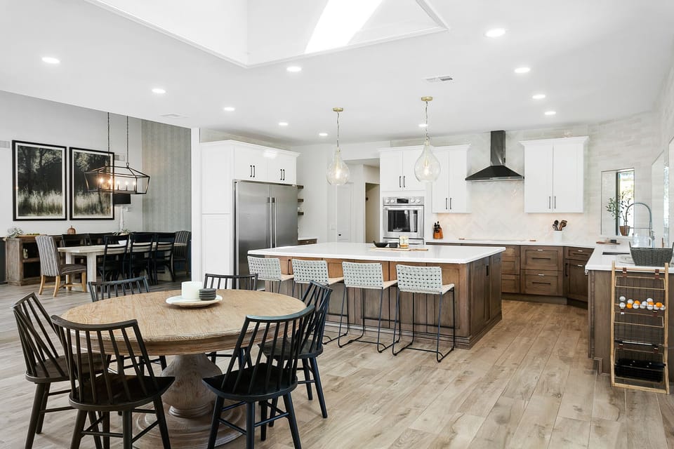 Gather in this open concept kitchen, dining space
