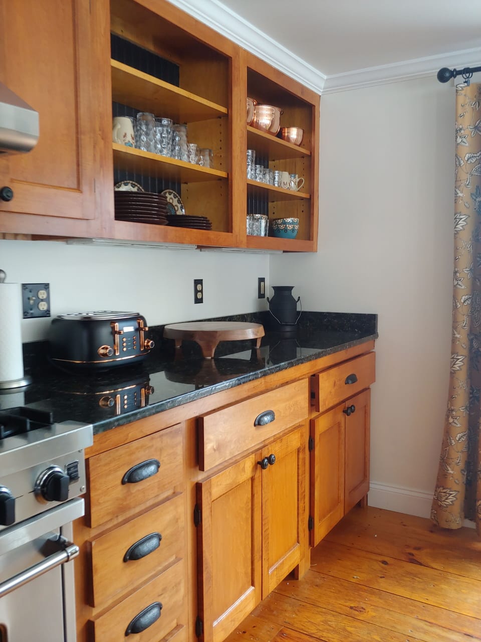 Ample granite counter space. 6 burner gas Viking stove. open shelfs, fun dishes
