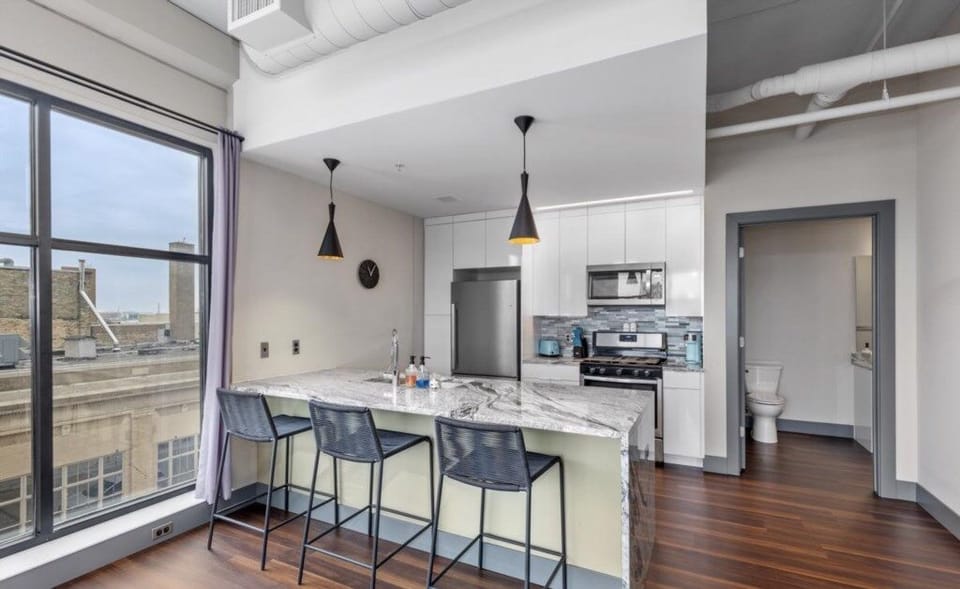 kitchen with island and seating for three