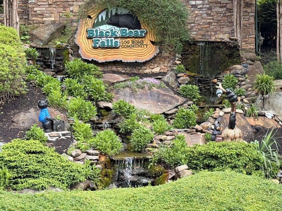 Scenic entrance featuring the resort’s waterfall at the clubhouse