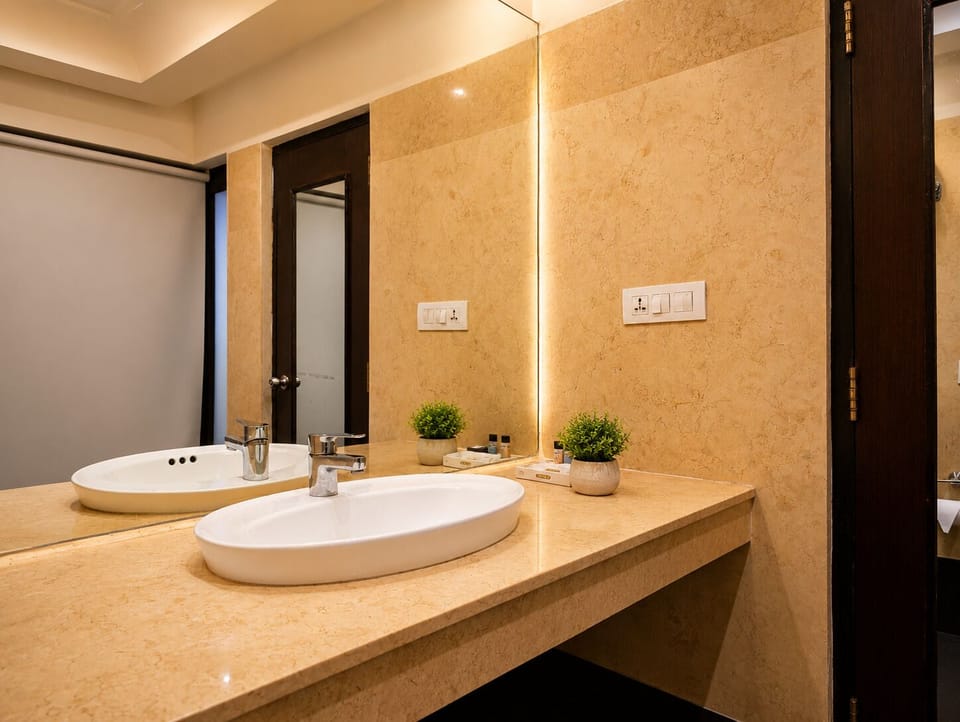 Executive Room | Bathroom | Free toiletries, hair dryer, slippers, towels