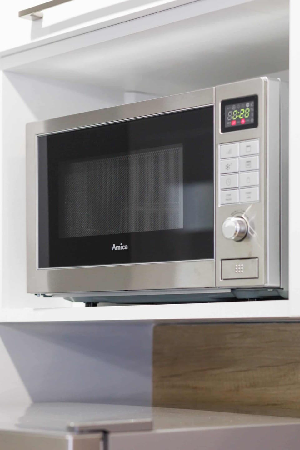 A detail shot of the built-in microwave, conveniently placed for easy access.