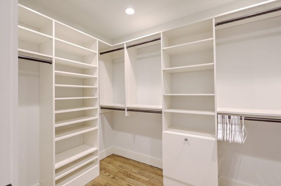 Spacious walk-in closet with plenty of shelving and storage space.