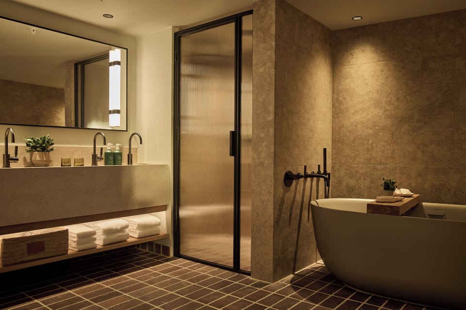 Studio Suite, 2 Queen Beds | Bathroom | Eco-friendly toiletries, hair dryer, bathrobes, slippers