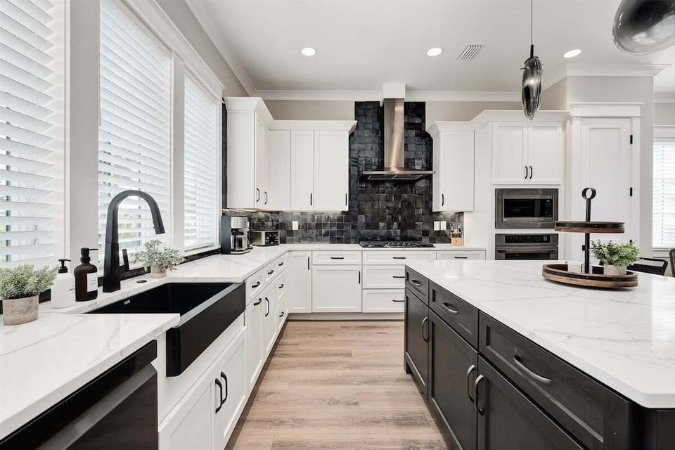 Glistening countertops along with multiple windows
