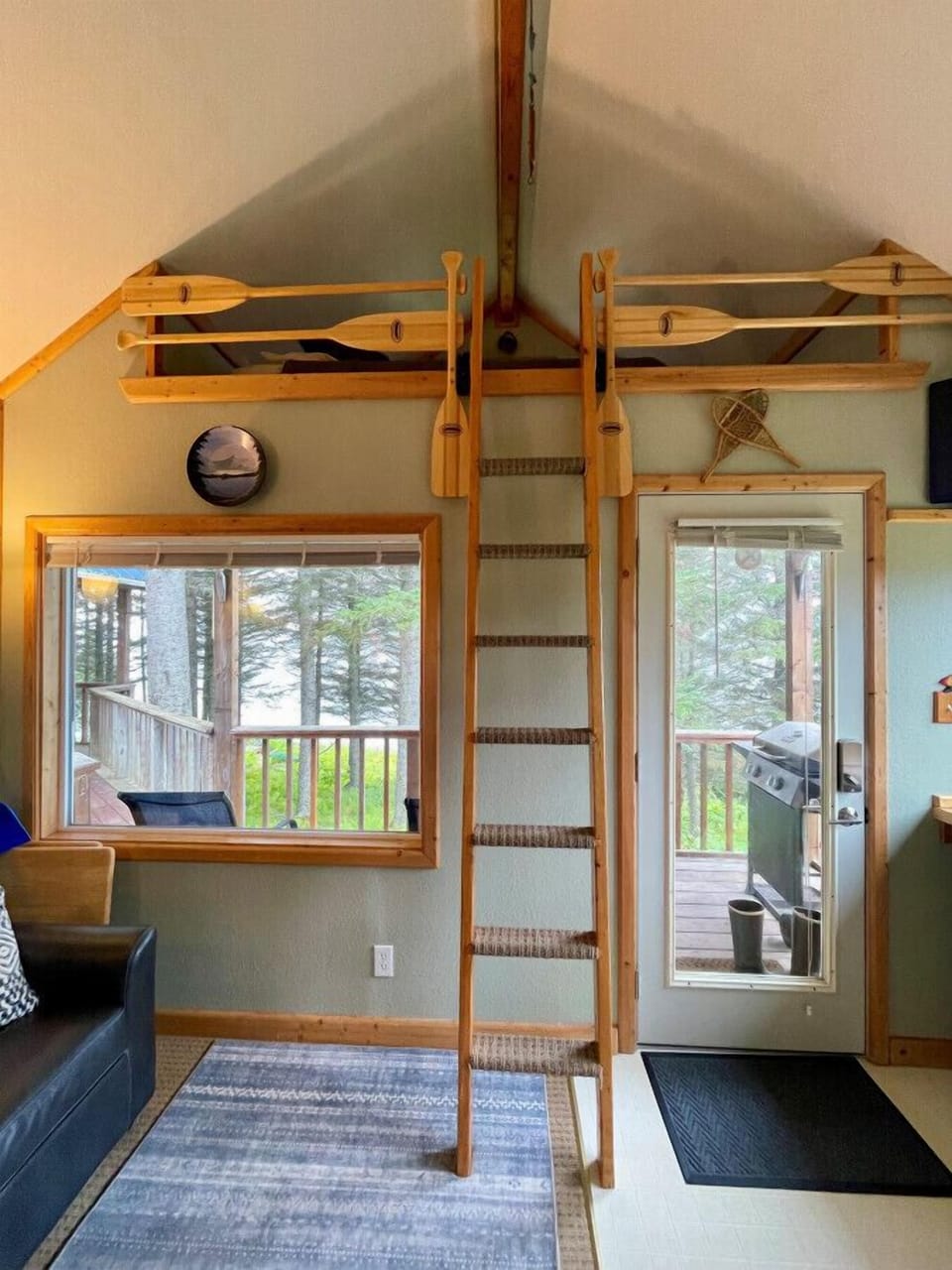 Ladder up to loft area with a full bed