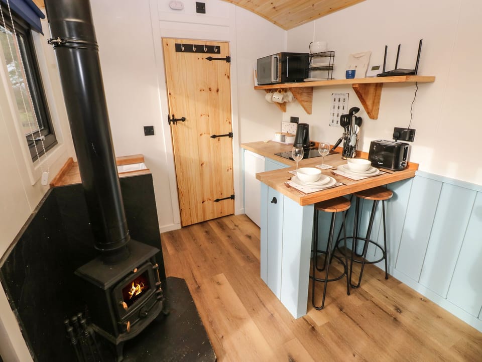 Fridge, electric kettle, cookware/dishes/utensils