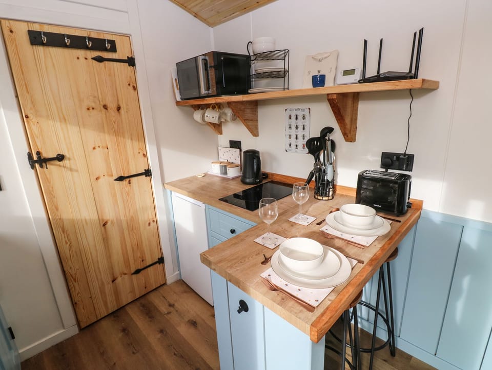 Fridge, electric kettle, cookware/dishes/utensils