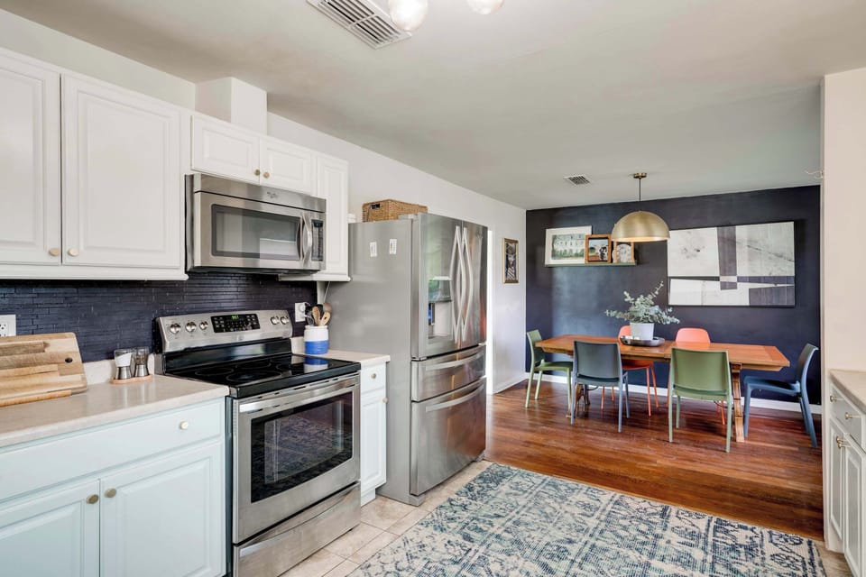 Fully stocked kitchen with basic cookware, electric stove/oven, dish washer and fridge. 