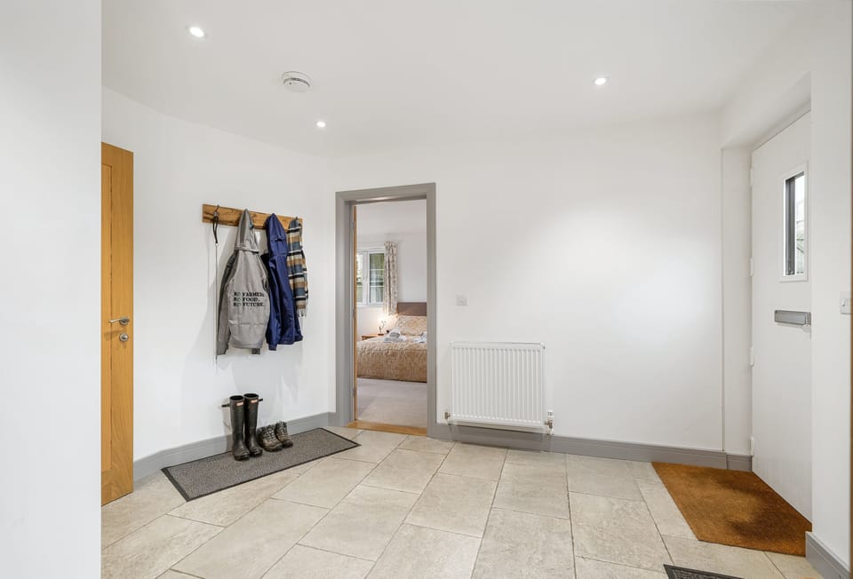 Hayloft at Trevissick Farm, Porthtowan. The entrance hall boasts plenty of space, WC and the downstairs bedroom