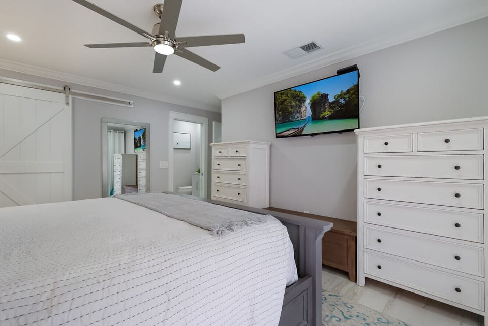 TV and plenty of storage in master bedroom
