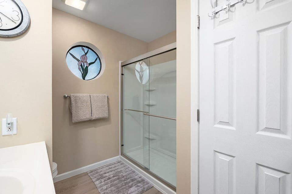 Walk-in shower in the main-floor king suite bathroom.
