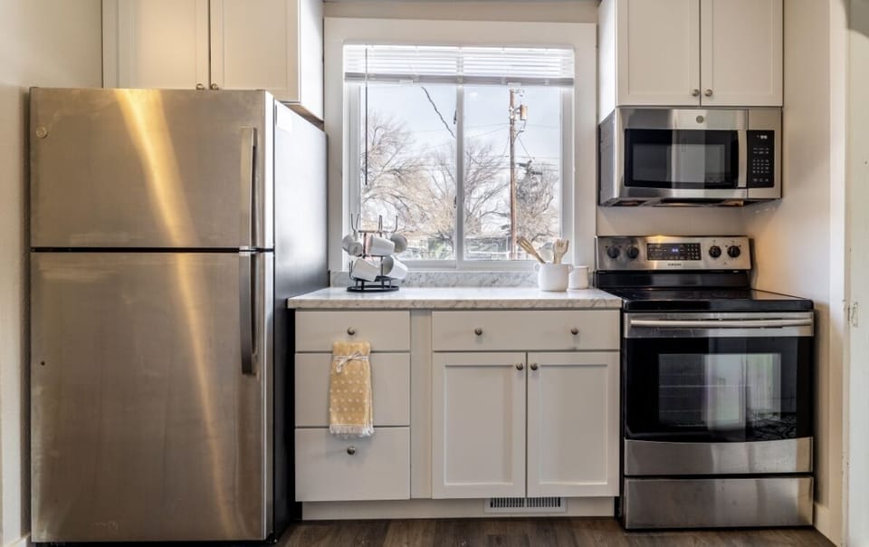 Renovated kitchen with new appliances, cabinets and countertops