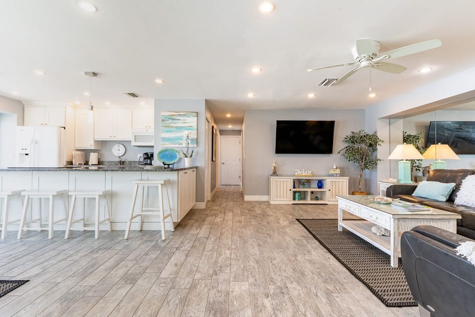 The living room is just off kitchen and dining area