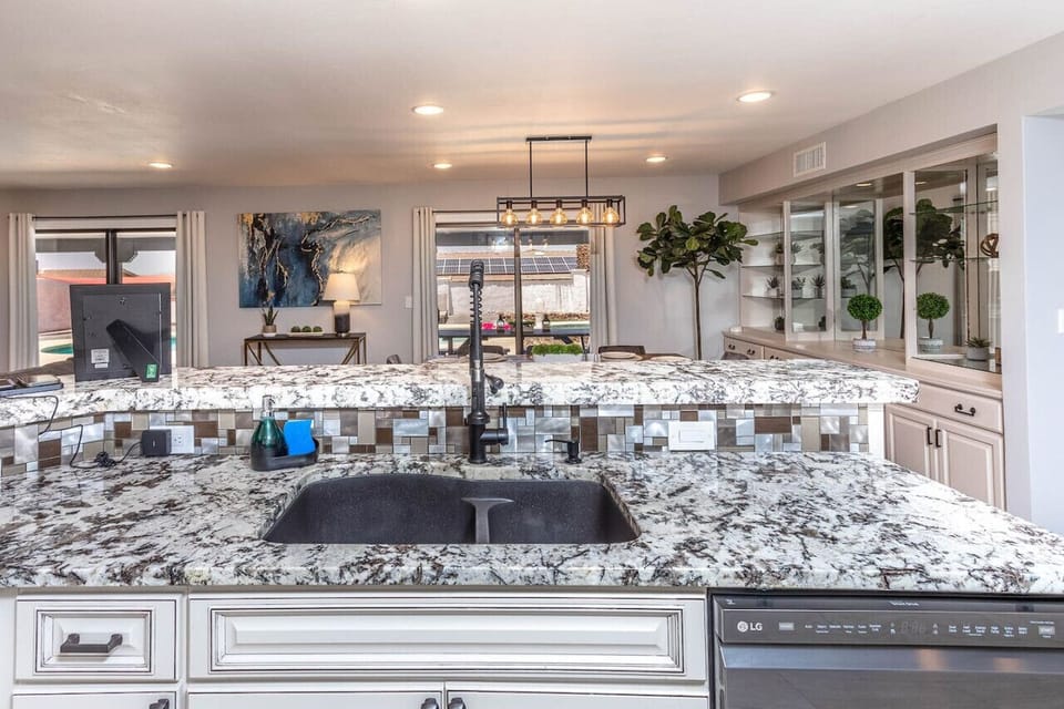 a fully equipped kitchen with a convenient sink setup.