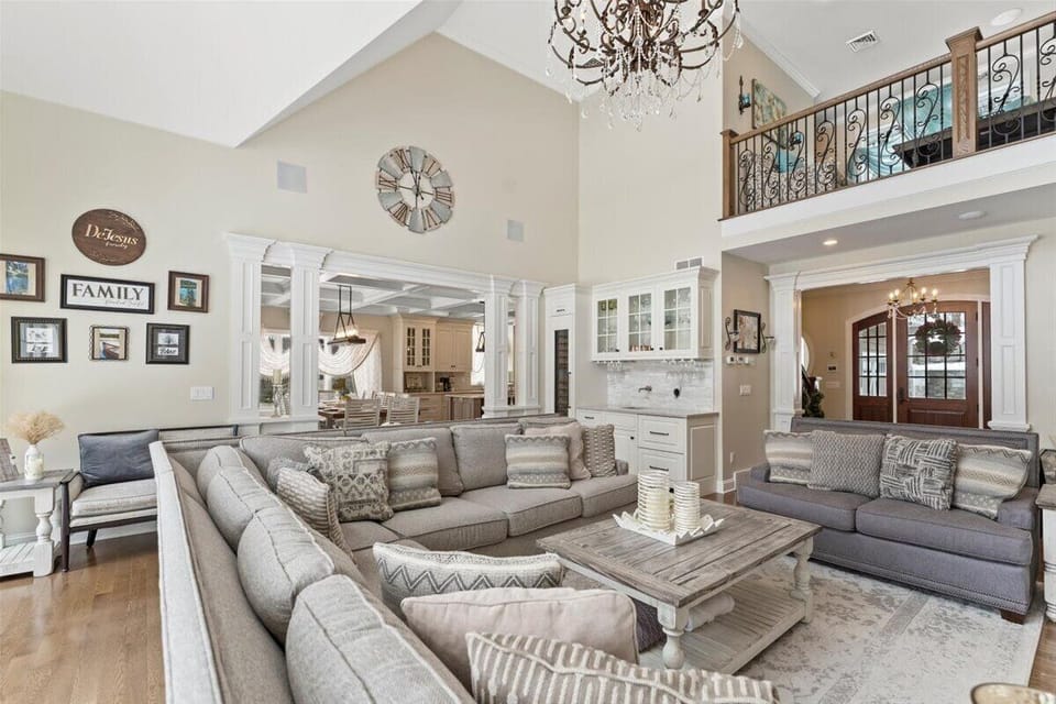 Living room with an electric fireplace and lake views. 