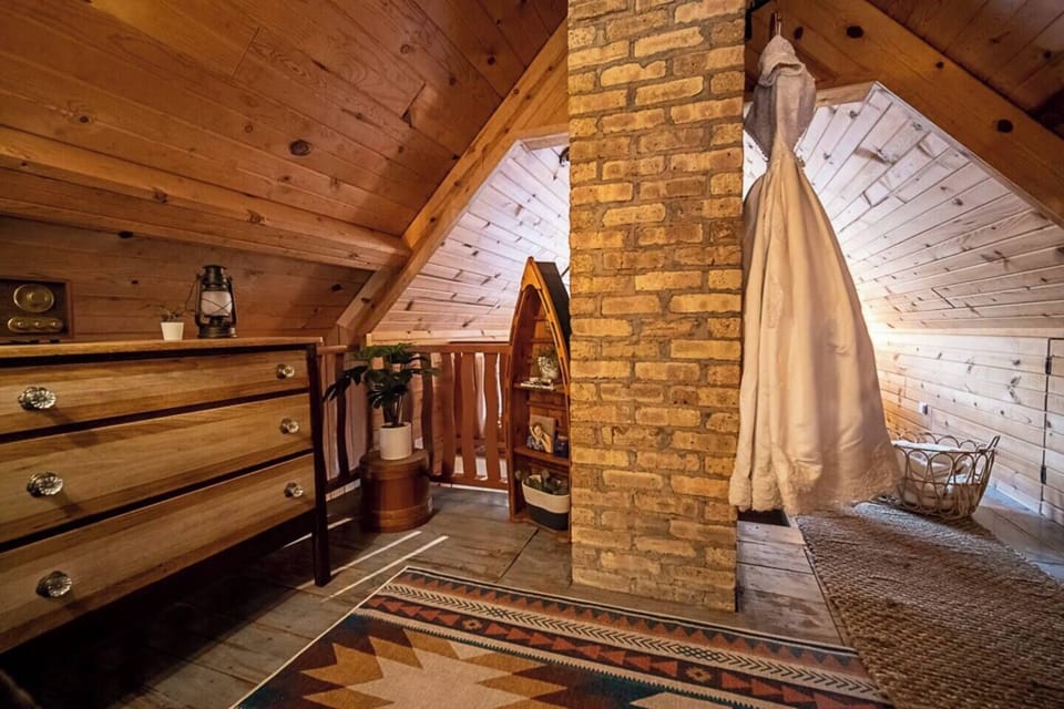 The dressing area of the upstairs loft, with a restored antique dresser.  