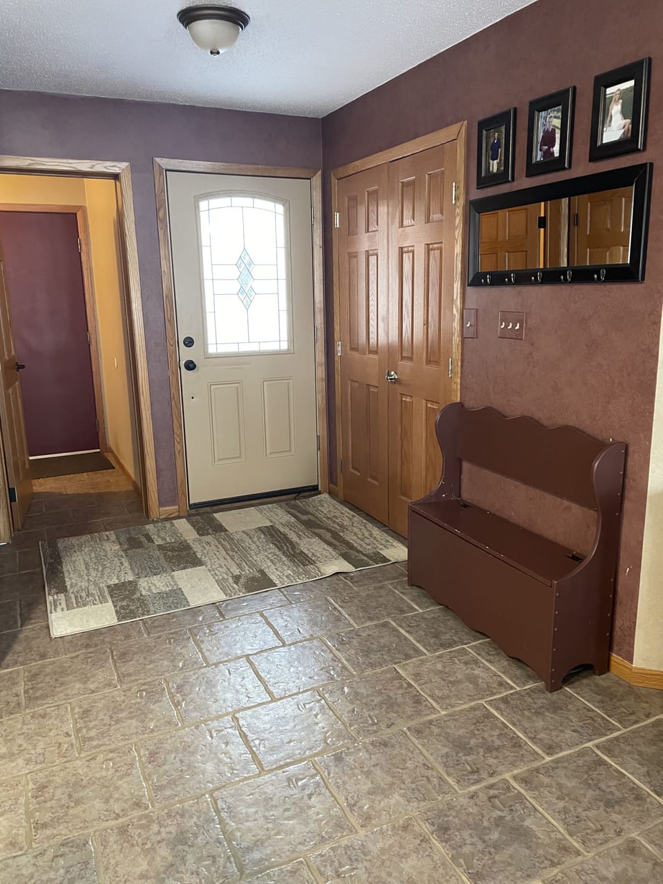 Front entry with laundry room next to it. Plentiful storage in the entry closet.