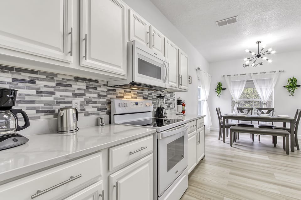 Another view of kitchen and dining area