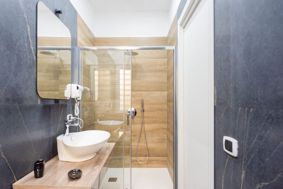 Comfort Room, 1 Bedroom, Courtyard View | Bathroom | Shower, rainfall showerhead, hair dryer, bidet
