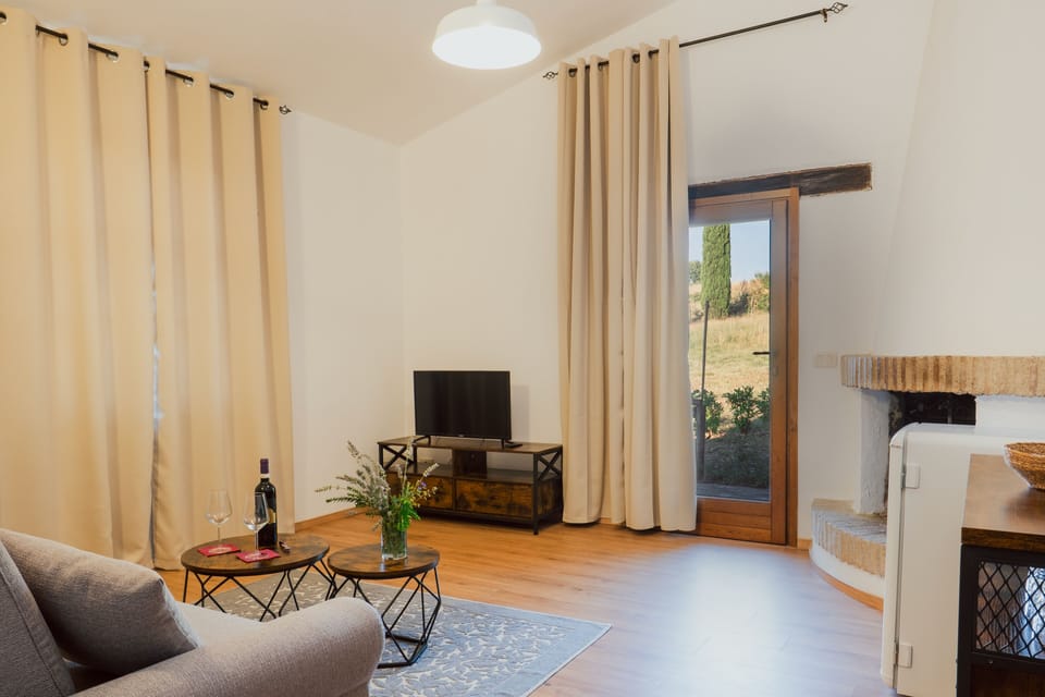 Junior Suite, 1 Queen Bed, Garden View | Living area | 18-inch flat-screen TV with digital channels