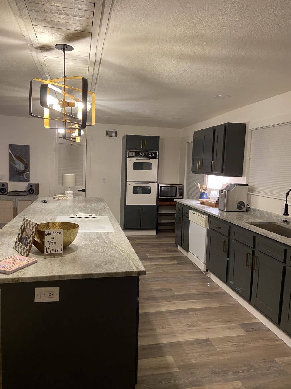 Large open kitchen with new granite countertops.