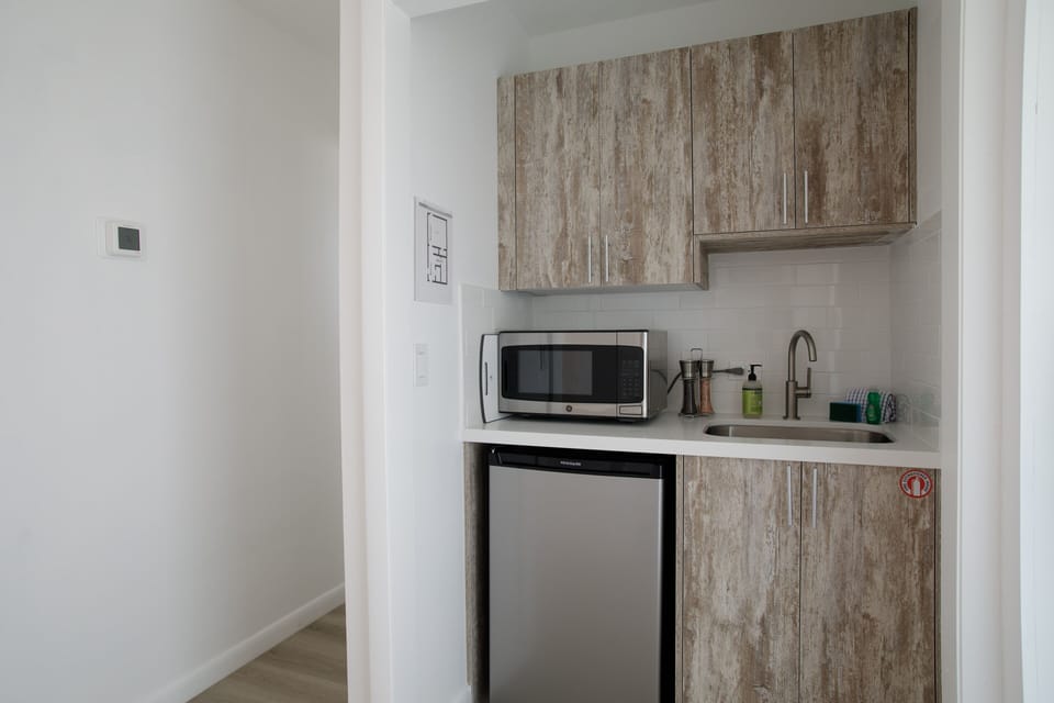 This updated kitchenette for all your late night snack and beverage needs!