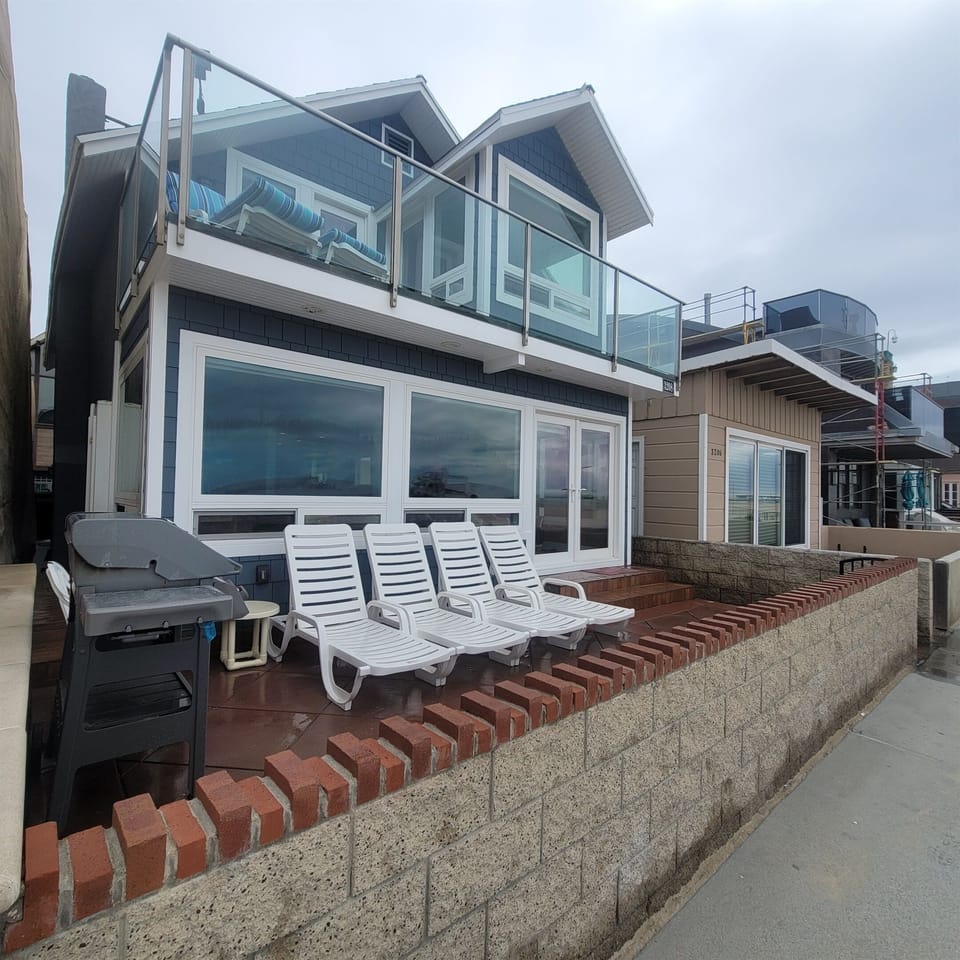 The view of the house from the Boardwalk. The front patio. The second floor sitting area also  