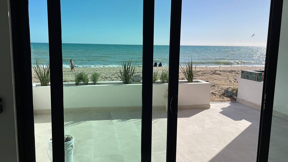 View looking out from downstairs family and kitchen at the ocean