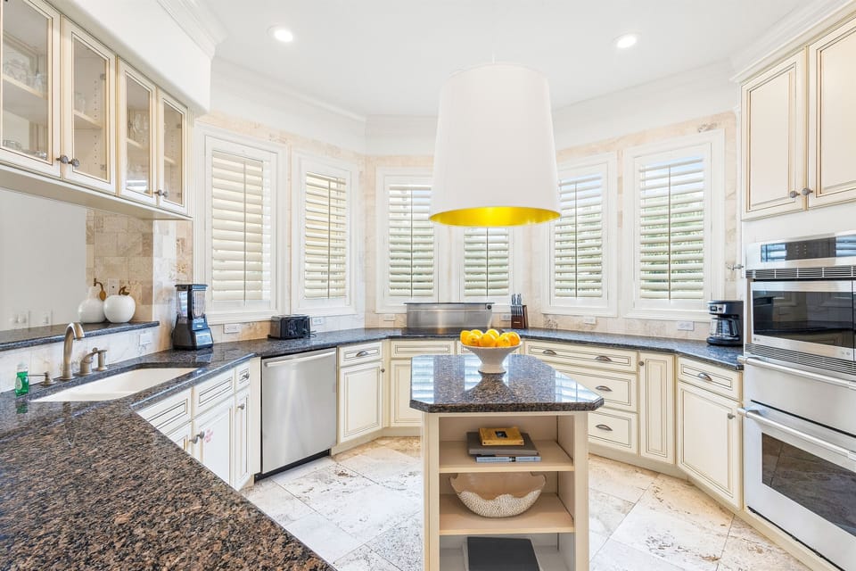 Prepare your favorite meals in this bright, spacious kitchen with granite countertops, stainless steel appliances, and plenty of room to cook.