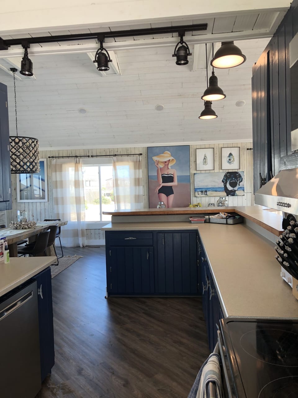 Well stocked open kitchen with ocean views while preparing meals