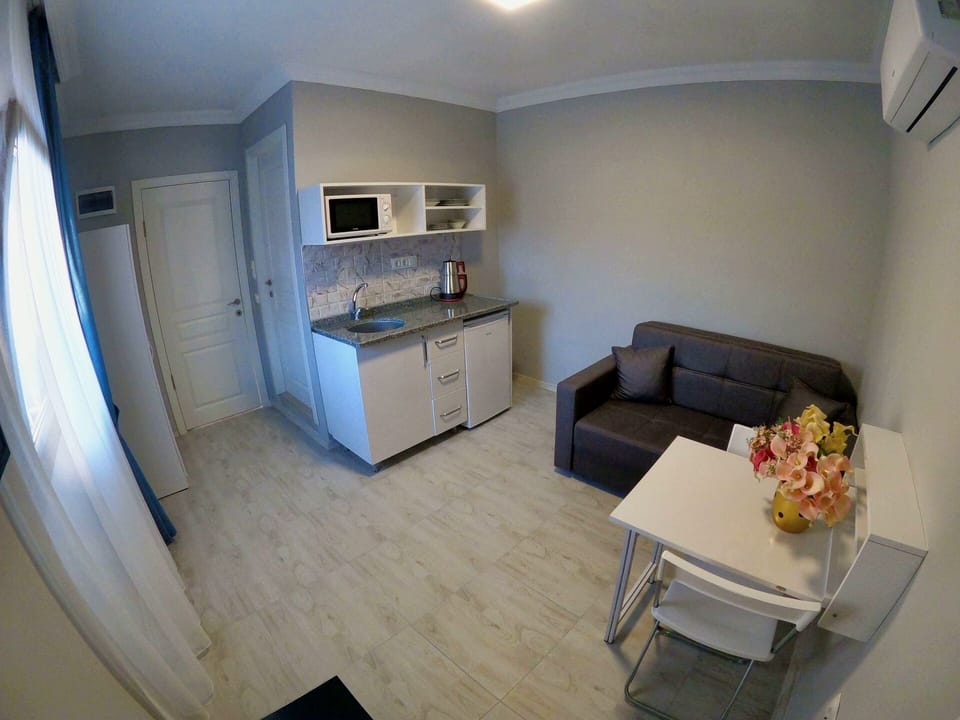 Fridge, microwave, cookware/dishes/utensils, dining table