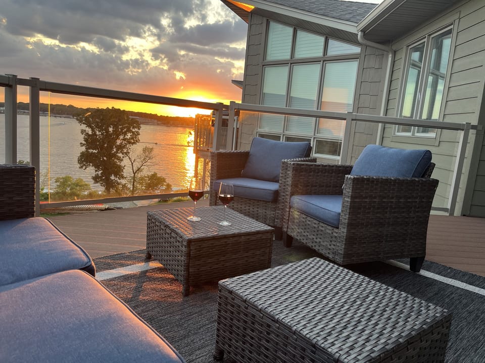 Enjoy expansive views and incredible sunsets from this top floor deck! 