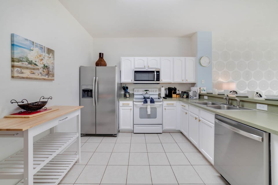 Kitchen stocked with dishes and appliances