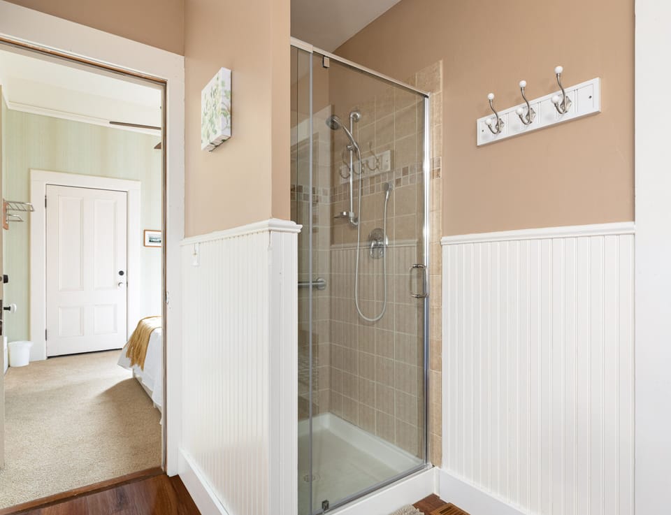 Bathroom and shower shared between first floor Queen and Full Bedrooms.