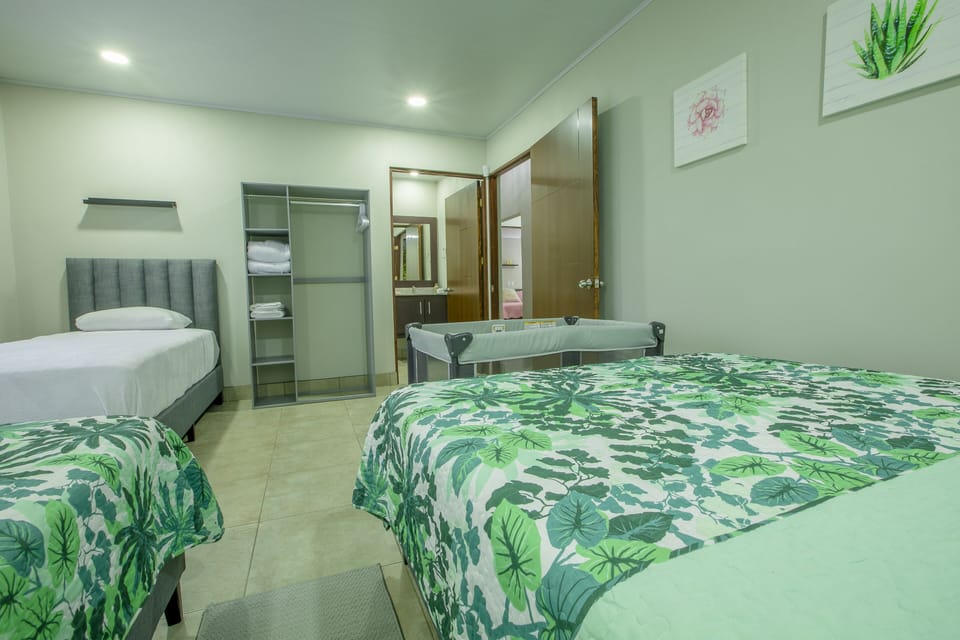 Bedroom 4: Two queen sized beds, one twin bed, A/C unit and private bathroom. 