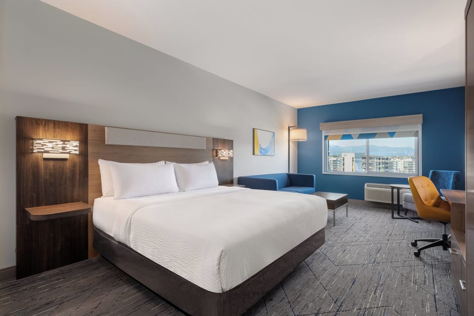 Deluxe Suite, 1 King Bed, Mountain View | Desk, laptop workspace, blackout drapes, iron/ironing board