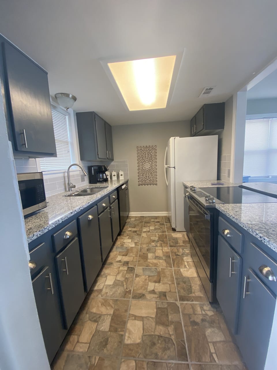 Newly remodeled kitchen. New appliances, granite counters and ceramic tile floor