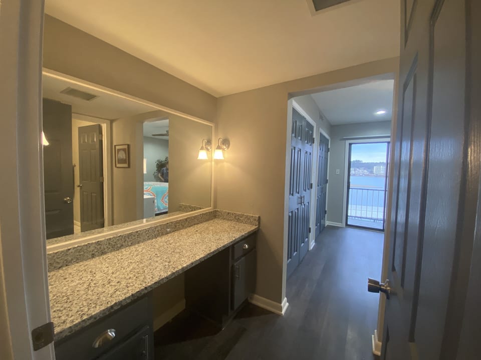 Master en suite dressing room between bedroom and bath. New granite countertop. 