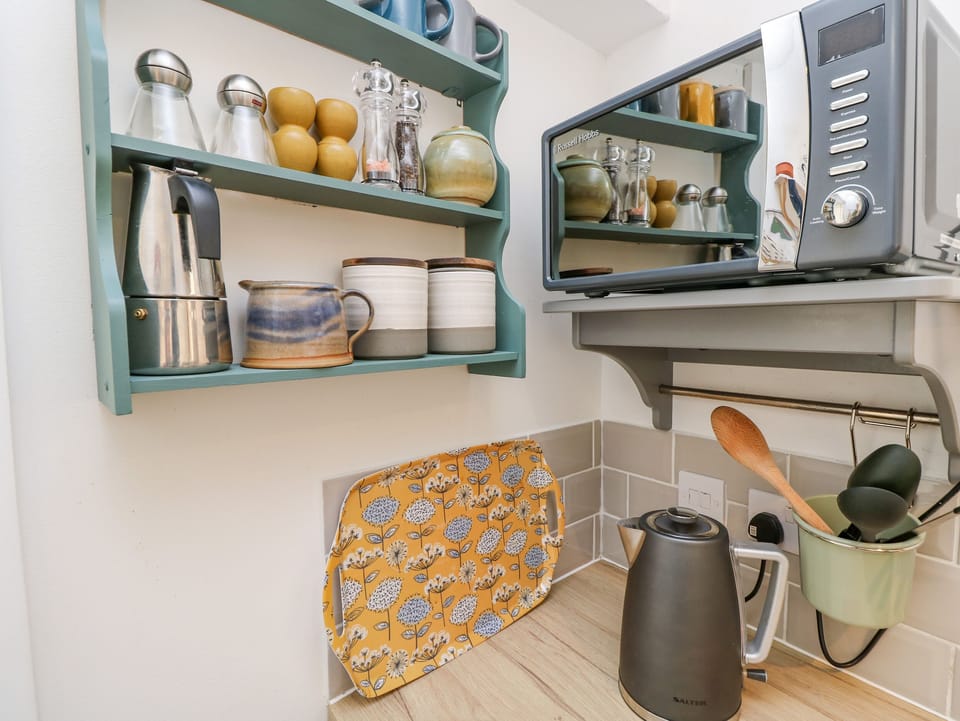 Fridge, electric kettle, toaster, cookware/dishes/utensils