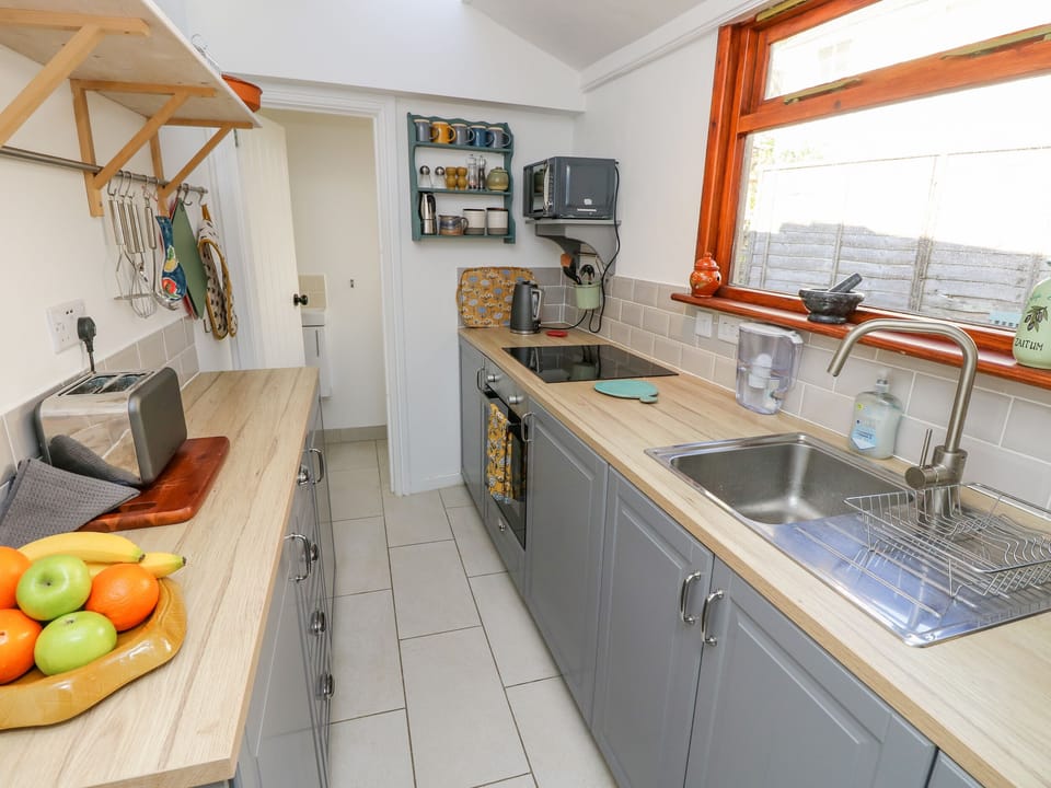 Fridge, electric kettle, toaster, cookware/dishes/utensils