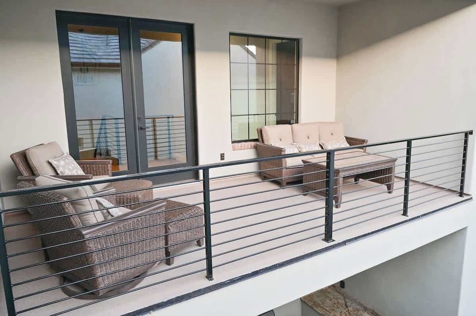 Upstairs balcony overlooking the courtyard/pool area.
