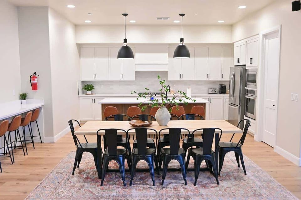 Large dining table that seats 10 with bar seating for 10 more.