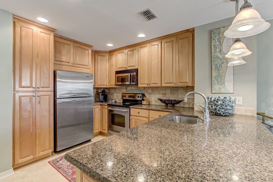 Fully Equipped Kitchen with Stainless Steel Appliances and Stunning Granite Countertops