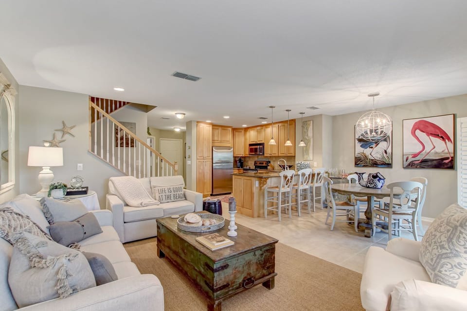 Living Space with Ample Seating and a Large Flat Screen Smart TV
