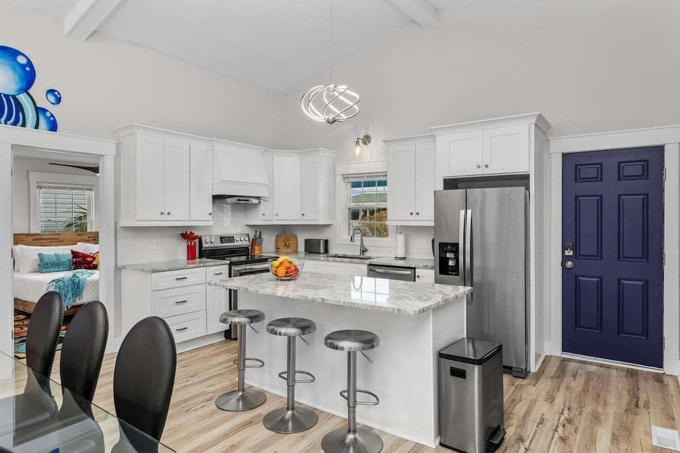 Experience culinary delight in our fully equipped kitchen, complete with a center island. From preparing gourmet meals to casual snacks, this kitchen offers modern appliances and ample counter space to cater to your every culinary desire